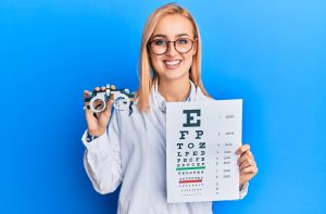 optometrist-holding-optometry-glasses-and-chart