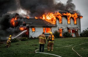 firefighters-controlling-house-on-fire